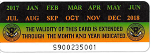 USCIS sticker validating the month and year extension of the Permanent Resident Card.
