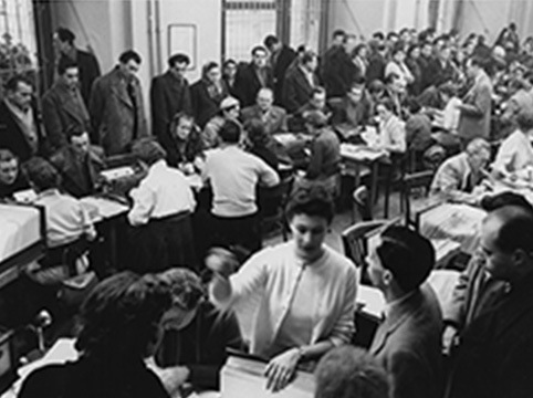 Picture of INS employees relocated temporarily to Austria to help process the influx of Hungarian refugees and parolees in November and December 1956.